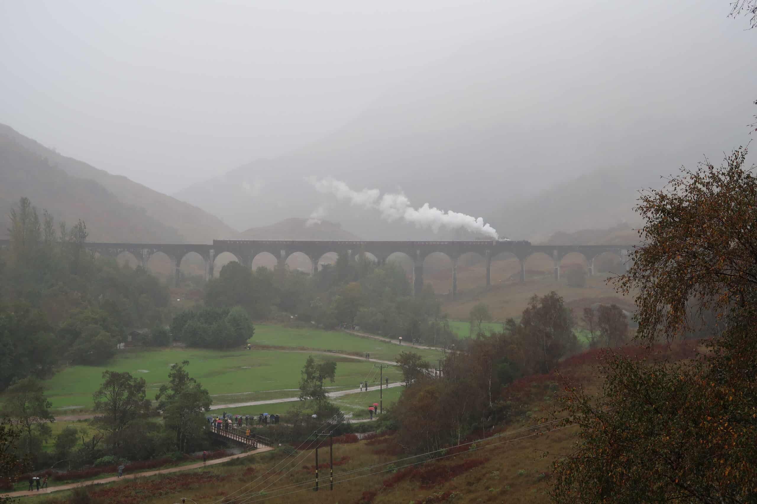 jacobite steam train scotland glenfinnan viaduct travelling from mallaig to fort william viewpoint best photo spots pouring rain october autumn